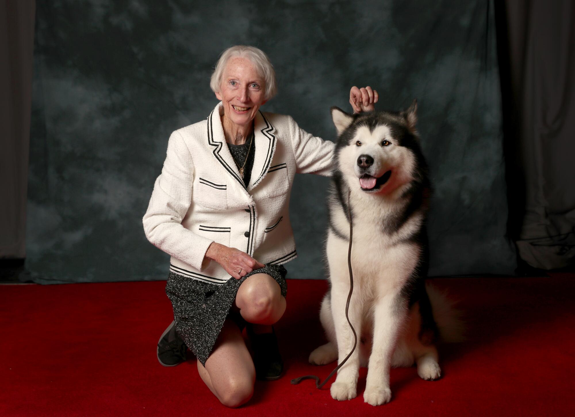 Gloria Toussaint of Yucaipa poses with "Bogie," a 4-year-old Alaskan malamute, at the Kennel Club of Beverly Hills Dog Show.