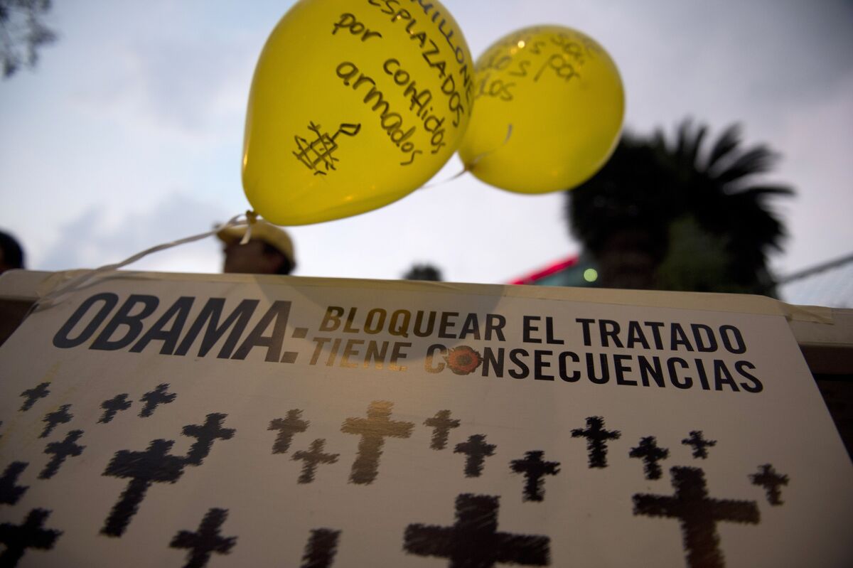 Activists of Amnesty International hold a protest in front of the U.S. Embassy in Mexico City. Dozens of activists demand that President Obama assume a responsible role in the negotiations of a Treaty on Arms Trade.
