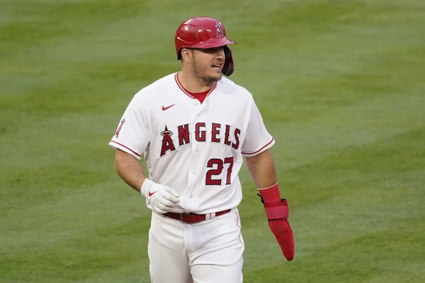 Los Angeles Angels' Mike Trout (27) walks back to first base during the first inning of a baseball game against the Cleveland Indians Monday, May 17, 2021, in Los Angeles. (AP Photo/Ashley Landis)