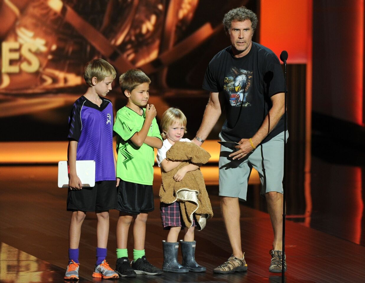 The final few minutes of any marathon awards show can find most people a little punchy. Maybe that's why Will Ferrell's bit about coming on stage in shorts and T-shirt with his three kids in tow went over so well. Claiming that he was a last-minute presenter to announce the winners of best comedy series and best drama series, the Ferrell clan stole the show.