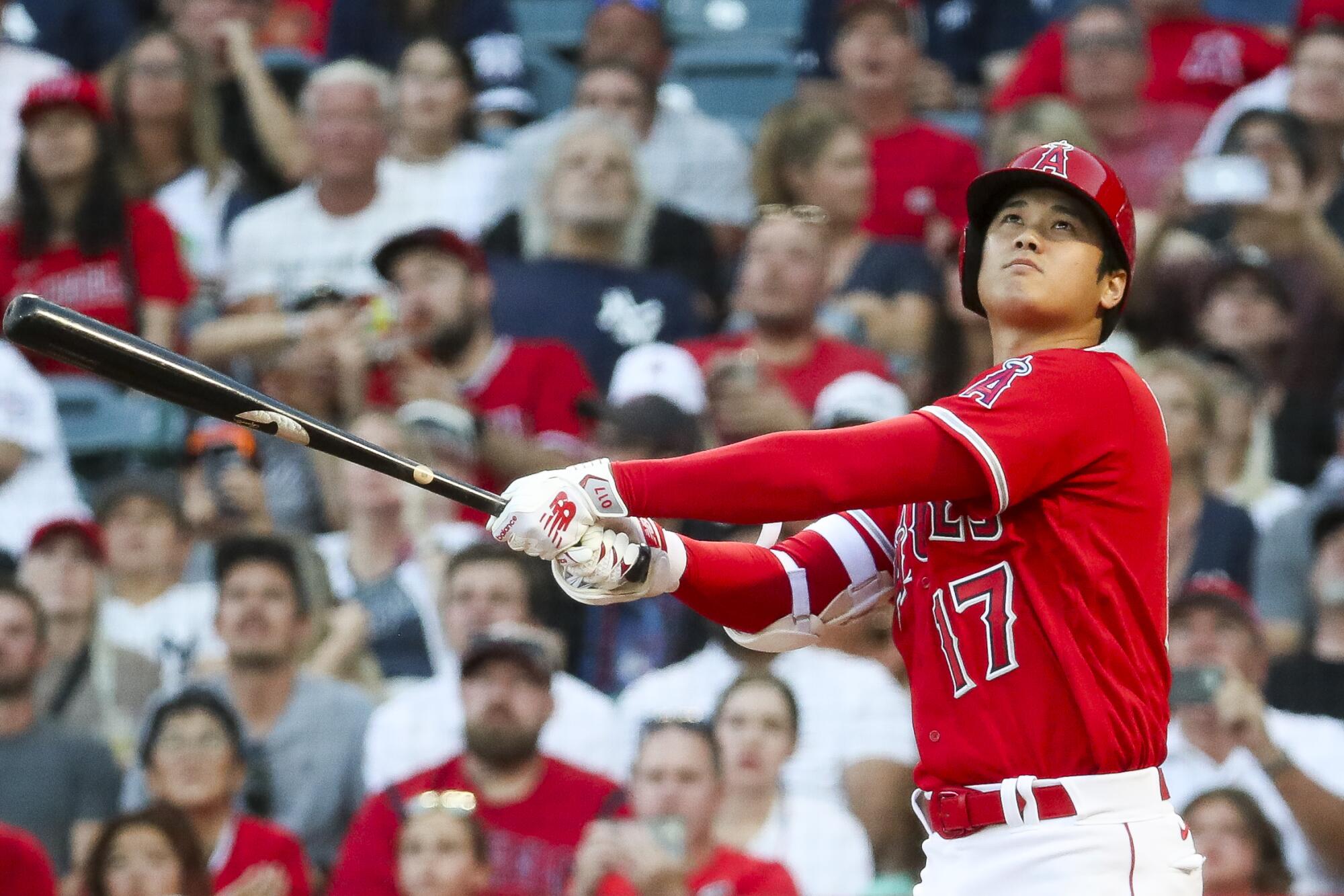 Shohei Ohtani swings the bat during a game against the Yankees at Angel Stadium.