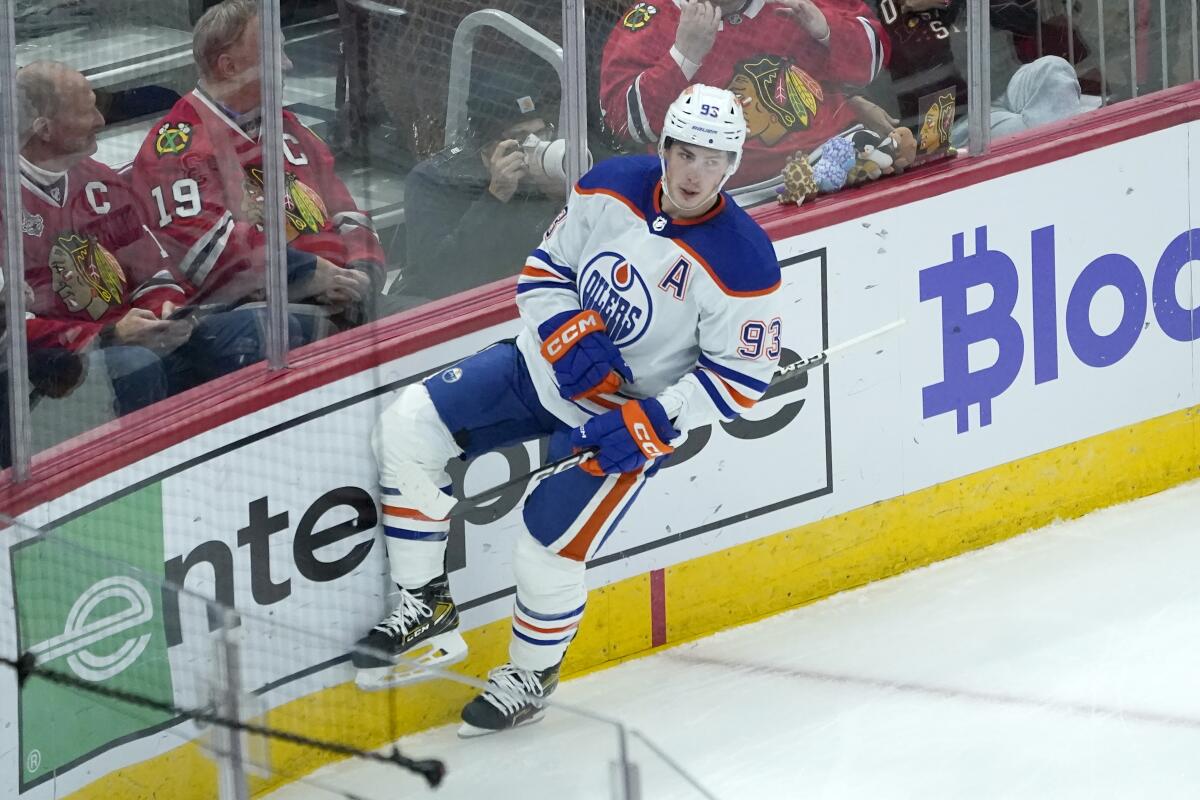 Edmonton Oilers' Ryan Nugent-Hopkins celebrates his goal during the second period of an NHL hockey game against the Chicago Blackhawks Wednesday, Nov. 30, 2022, in Chicago. (AP Photo/Charles Rex Arbogast)
