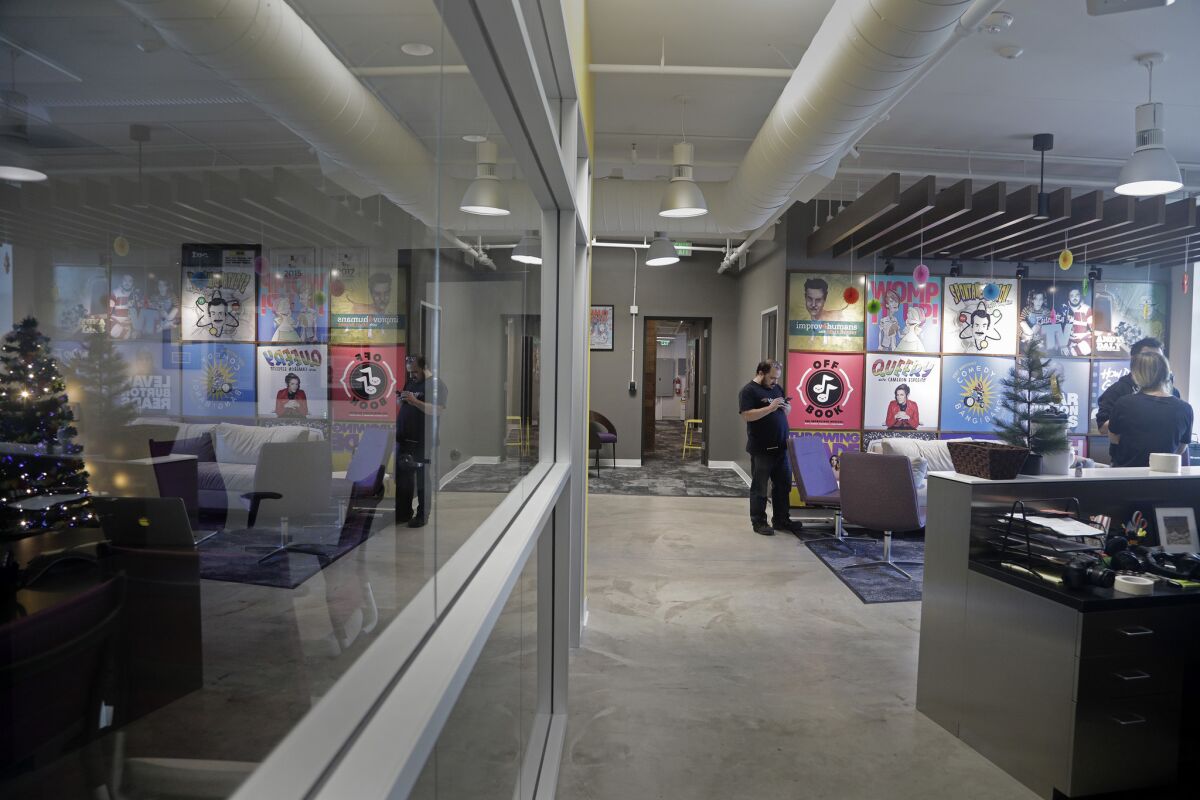 The lobby of comedy podcasting network Earwolf with posters of their programs. The company has expanded to include big-name talents, including Conan O'Brien.