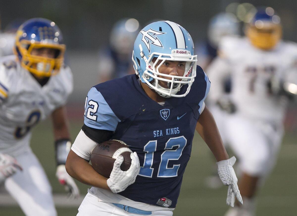 Corona del Mar High junior TaeVeon Le caught nine passes for 234 yards and three touchdowns last week in the Sea Kings’ 42-13 win against El Toro.