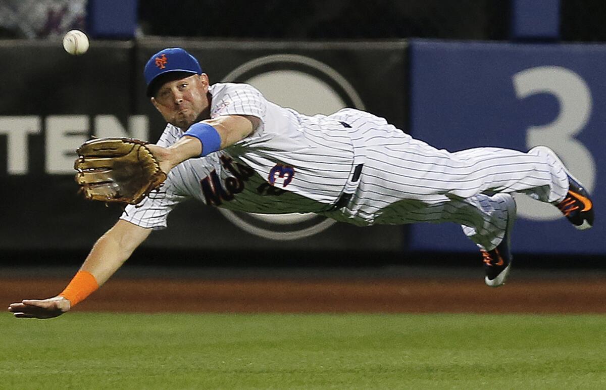 New York Mets right fielder Michael Cuddyer makes a leaping catch of a line drive from Miami's Martin Prado during the first inning of a game on Sept. 16.