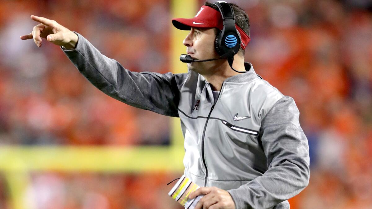 Steve Sarkisian communicates with Alabama players during the College Football Playoff title game on Jan. 9.