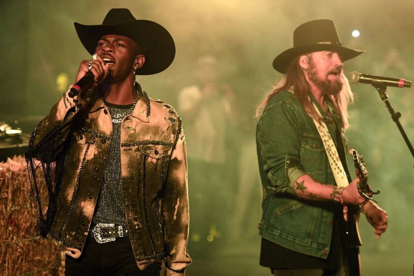 INDIO, CALIFORNIA - APRIL 28: Lil Nas X and Billy Ray Cyrus perform onstage during the 2019 Stagecoach Festival at Empire Polo Field on April 28, 2019 in Indio, California. (Photo by Frazer Harrison/Getty Images for Stagecoach) ** OUTS - ELSENT, FPG, CM - OUTS * NM, PH, VA if sourced by CT, LA or MoD **