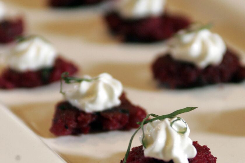 Latkes with a Swedish twist. Recipe: Red beet latkes with creme fraiche and chives