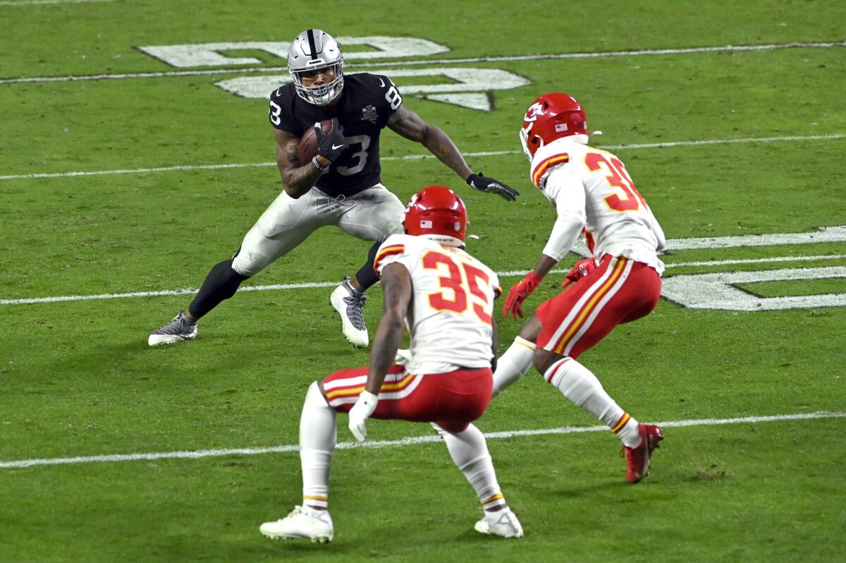 Las Vegas Raiders tight end Darren Waller runs with the ball.