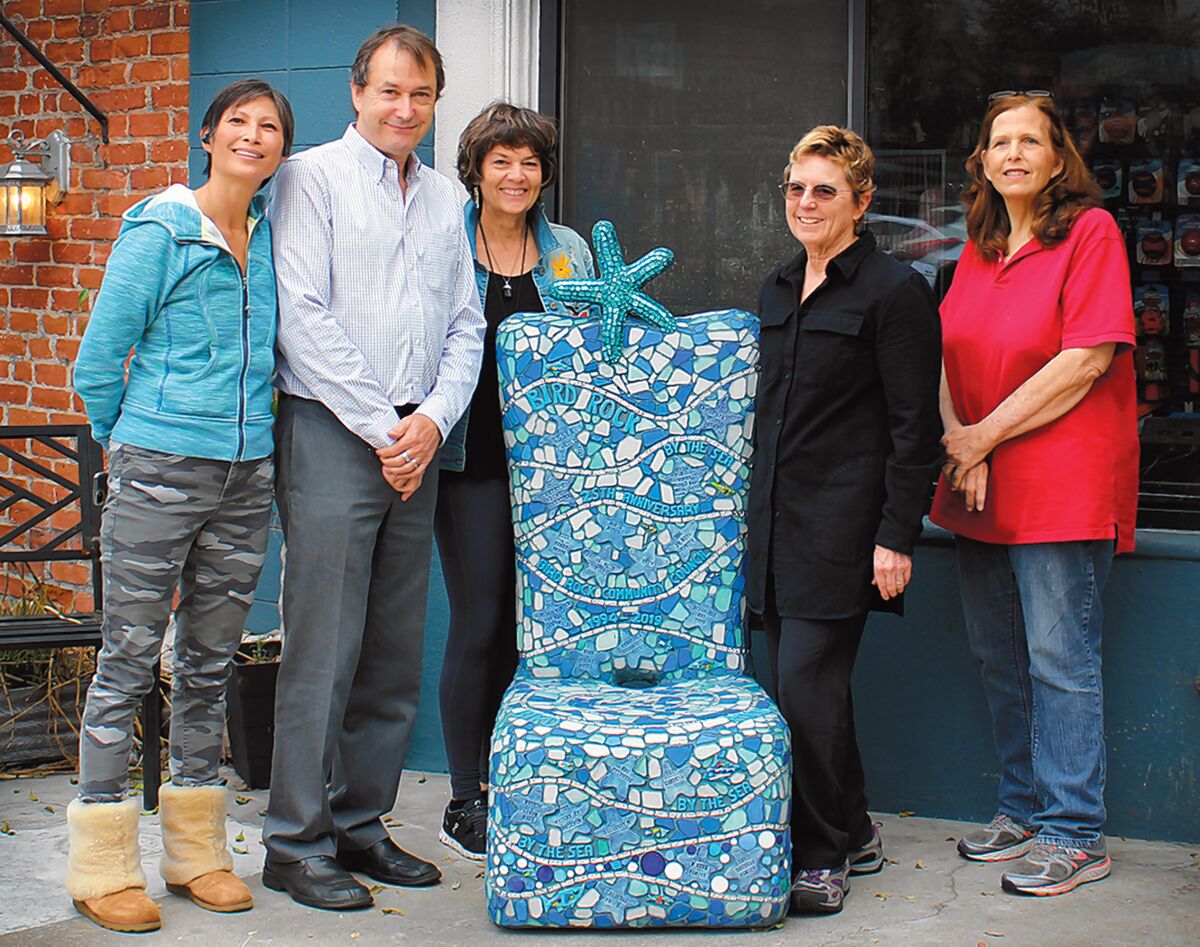 Bird Rock residents Tiffany Chow, John Newsam, Jane Wheeler, Barbara Dunbar and Lenise Delavar pose alongside the Bird Rock Community Council’s 2019 ‘25th Anniversary Chair,’ which now sits in front of All About Animals pet store, 5622 La Jolla Blvd.
