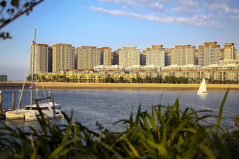 A section of the Evergrande mega-project complexes is seen on Haihua Islands in Danzhou in south China's Hainan province on Nov. 19, 2019. The troubled Chinese real estate developer that is struggling with $310 billion in debt announced Tuesday, Jan 4, 2022 it has been ordered to demolish a 39-building resort complex in the Southern province of Hainan in a new blow to its finances. (Chinatopix Via AP)
