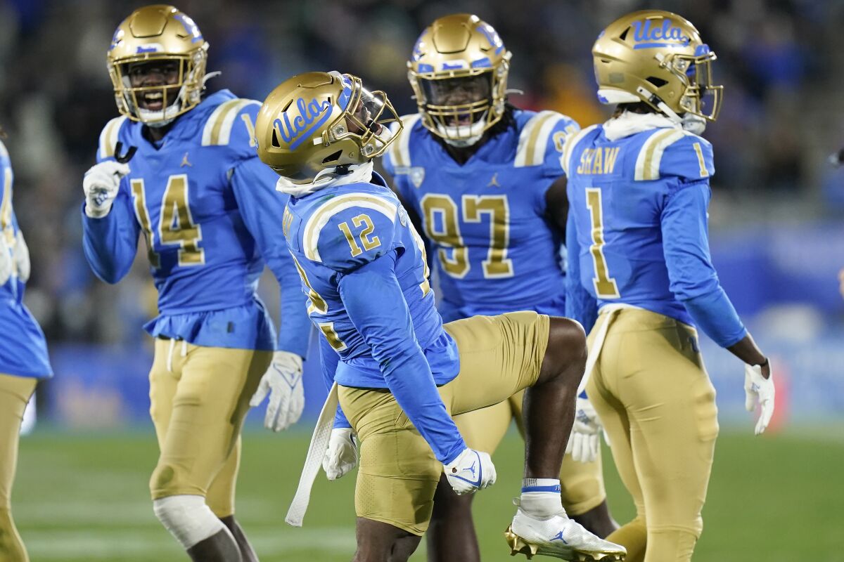 UCLA defensive back Martell Irby, center, reacts to a play during the second half of the Bruins' 42-14 win.