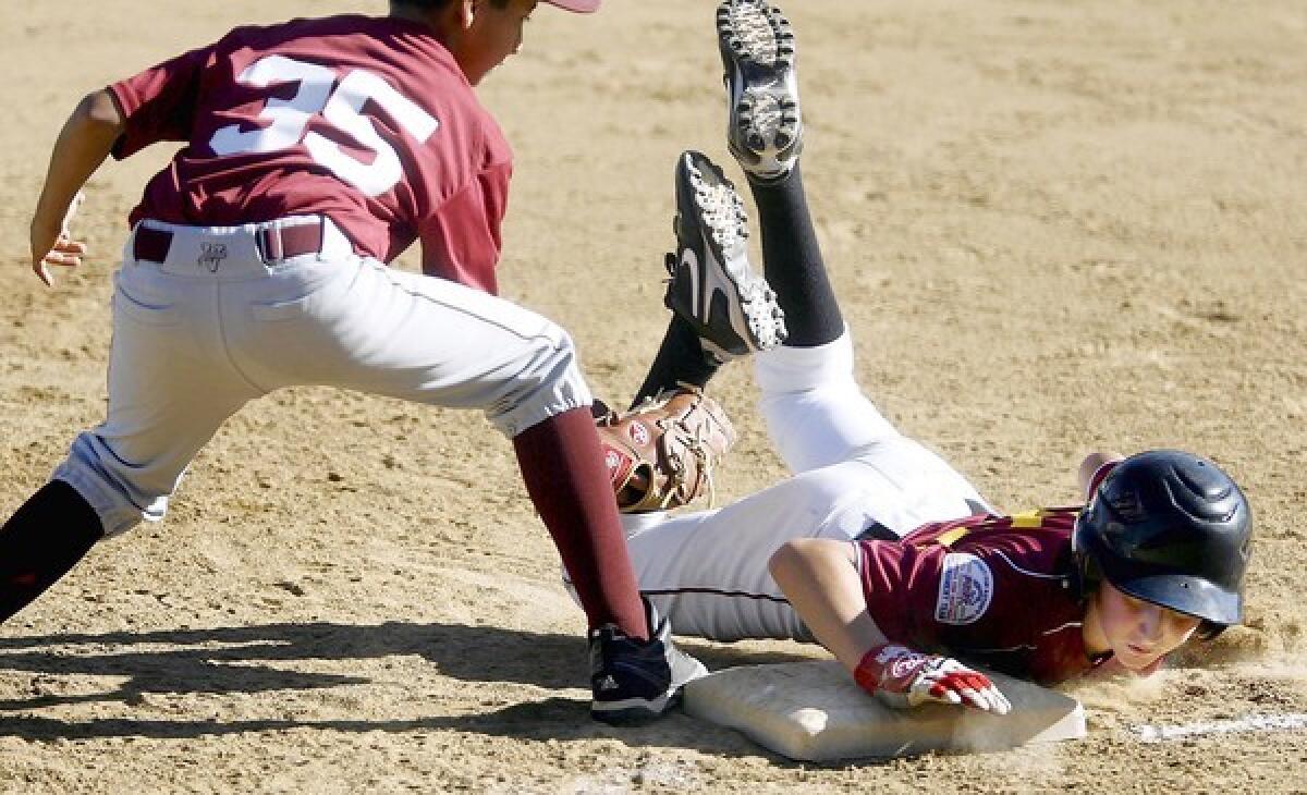 FILE PHOTO: La Canada's #10 John Paul Caire returns safely to first base during game vs. Arcadia at the La Canada Summer Smash in La Canada on Friday, June 29, 2012. In 2012, the tournament hosted 48 teams. This year there will be 45 teams on deck.