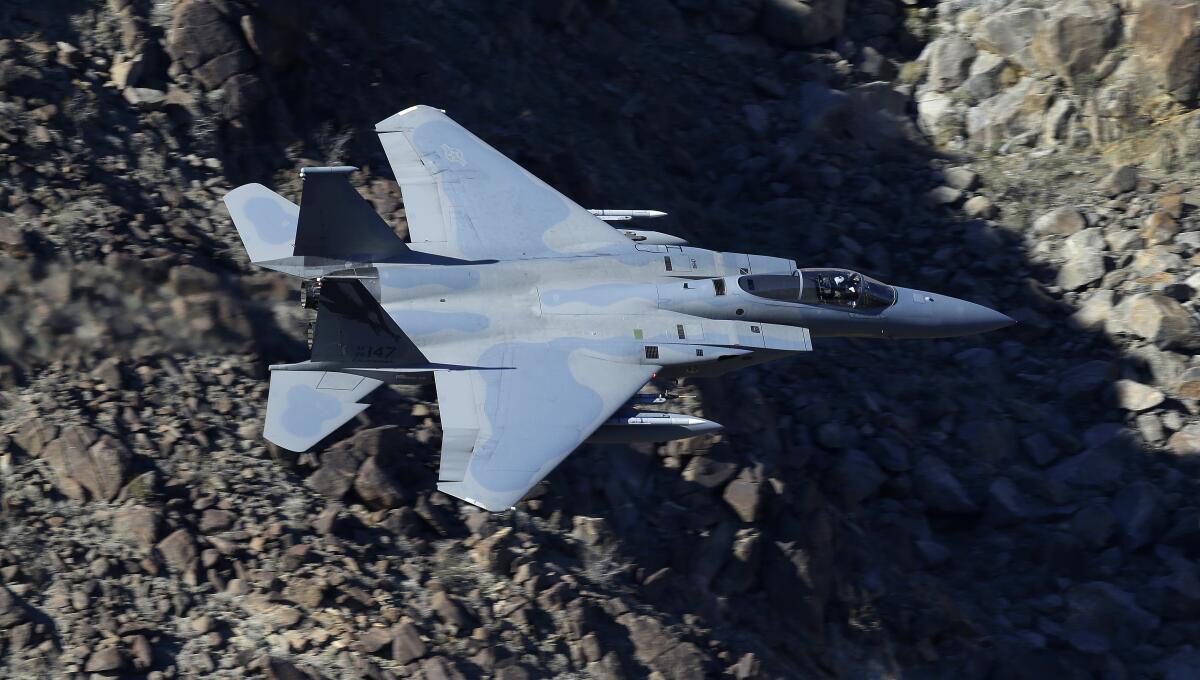 A fighter jet above the ground