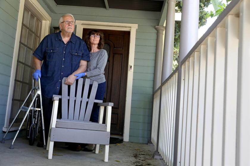 LOS ANGELES, CA -- APRIL 21: John and Susan Polifronio, owners of Counterpoint Records & Books, at their home on Tuesday, April 21, 2020, in Los Angeles, CA. Mom and pop shop that's being overlooked by federal small business loan program. Coronavirus business struggling. (Gary Coronado / Los Angeles Times)