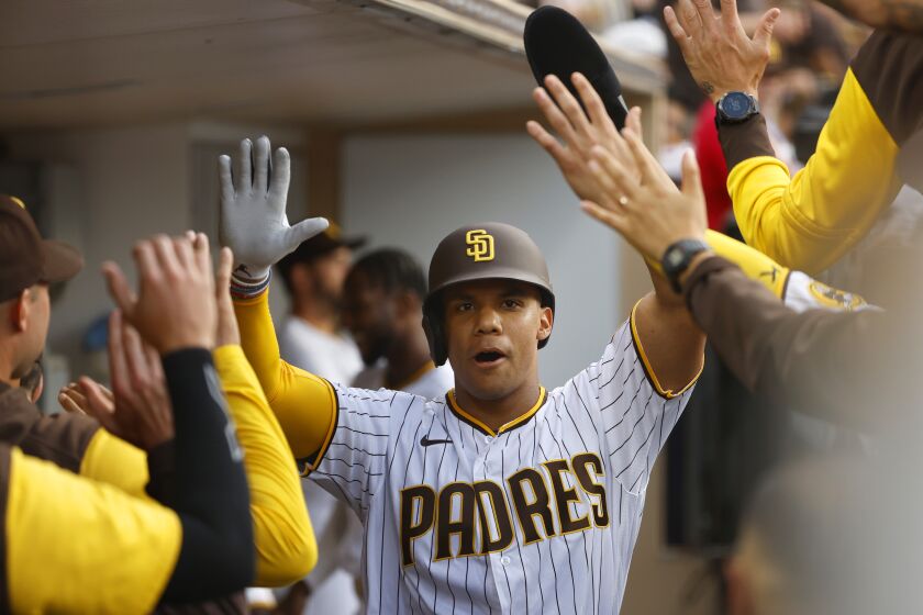 SAN DIEGO, CA - AUGUST 3: San Diego Padres' Juan Soto celebrates after scoring in the first inning against the Colorado Rockies at Petco Park on Tuesday, August 3, 2022 in San Diego, CA. (K.C. Alfred / The San Diego Union-Tribune)