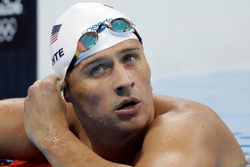 Ryan Lochte checks his time in a men's 4-by-200-meter freestyle race Aug. 9 at the Olympics in Rio de Janeiro.