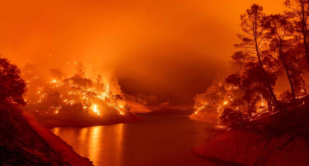 Flames consumes a segment of Lake Berryessa during the Hennessey fire in the Spanish Flat area of Napa.