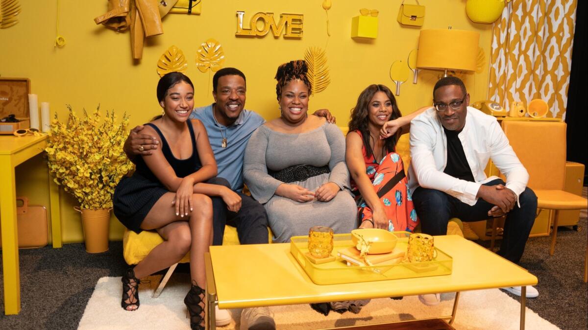 "The Hate U Give" author Angie Thomas, center, with, from left, actors Amandla Stenberg, Russell Hornsby, Regina Hall and director George Tillman Jr.