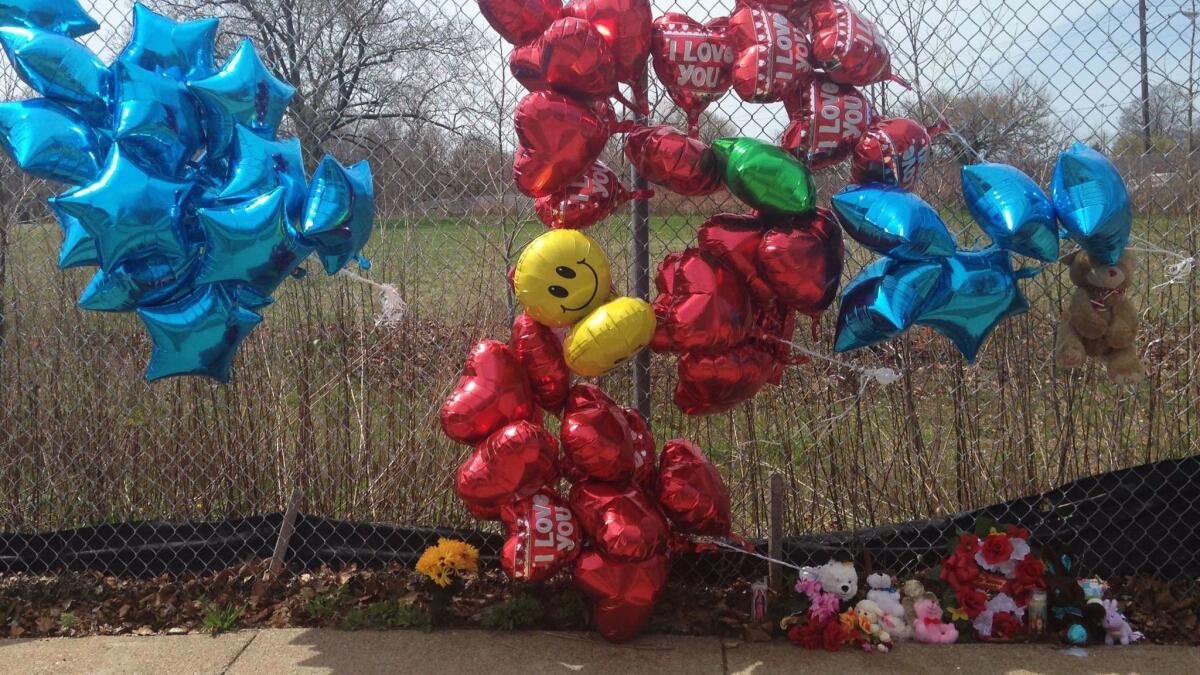 A makeshift memorial sits along a fence near where Robert Godwin Sr. was killed in Cleveland.