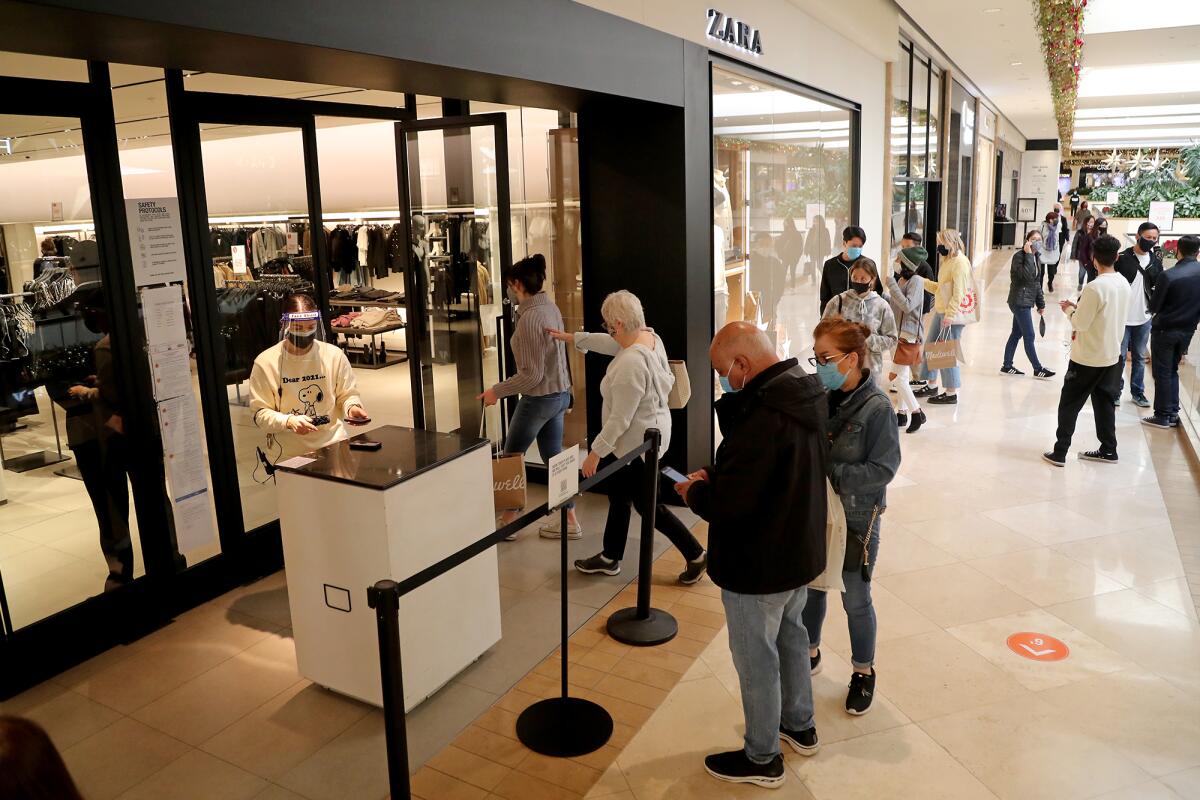 Black Friday shoppers wait in line to shop at Zara, a clothing store at South Coast Plaza.