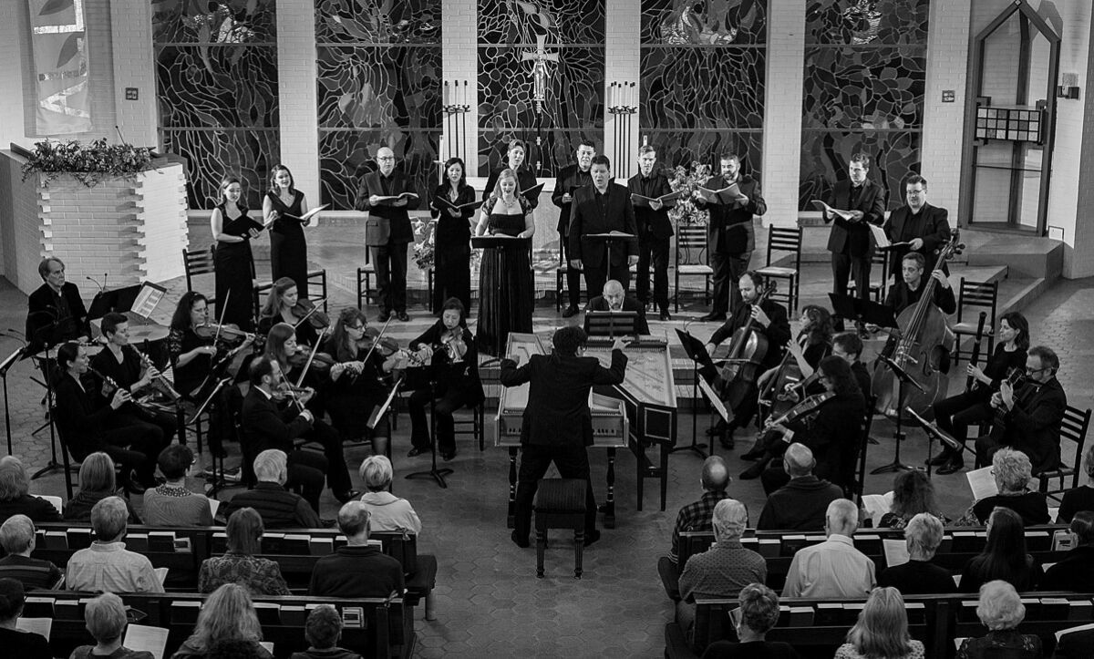 A photo of a classical music group performing in a church