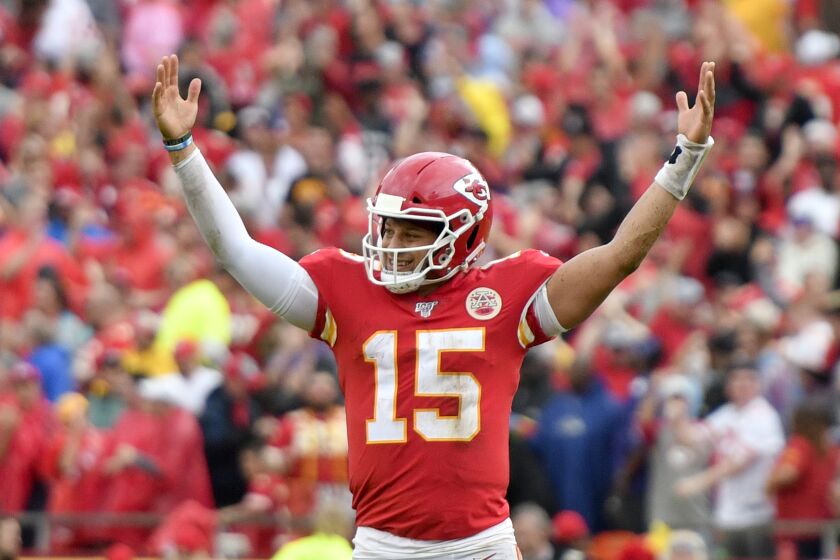 Kansas City Chiefs quarterback Patrick Mahomes (15) celebrates a touchdown by running back Darwin Thompson during the second half of an NFL football game against the Baltimore Ravens in Kansas City, Mo., Sunday, Sept. 22, 2019. (AP Photo/Ed Zurga)
