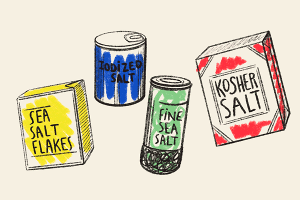 different packages of salts; sea salt flakes, iodized salt, fine sea salt and kosher salt 