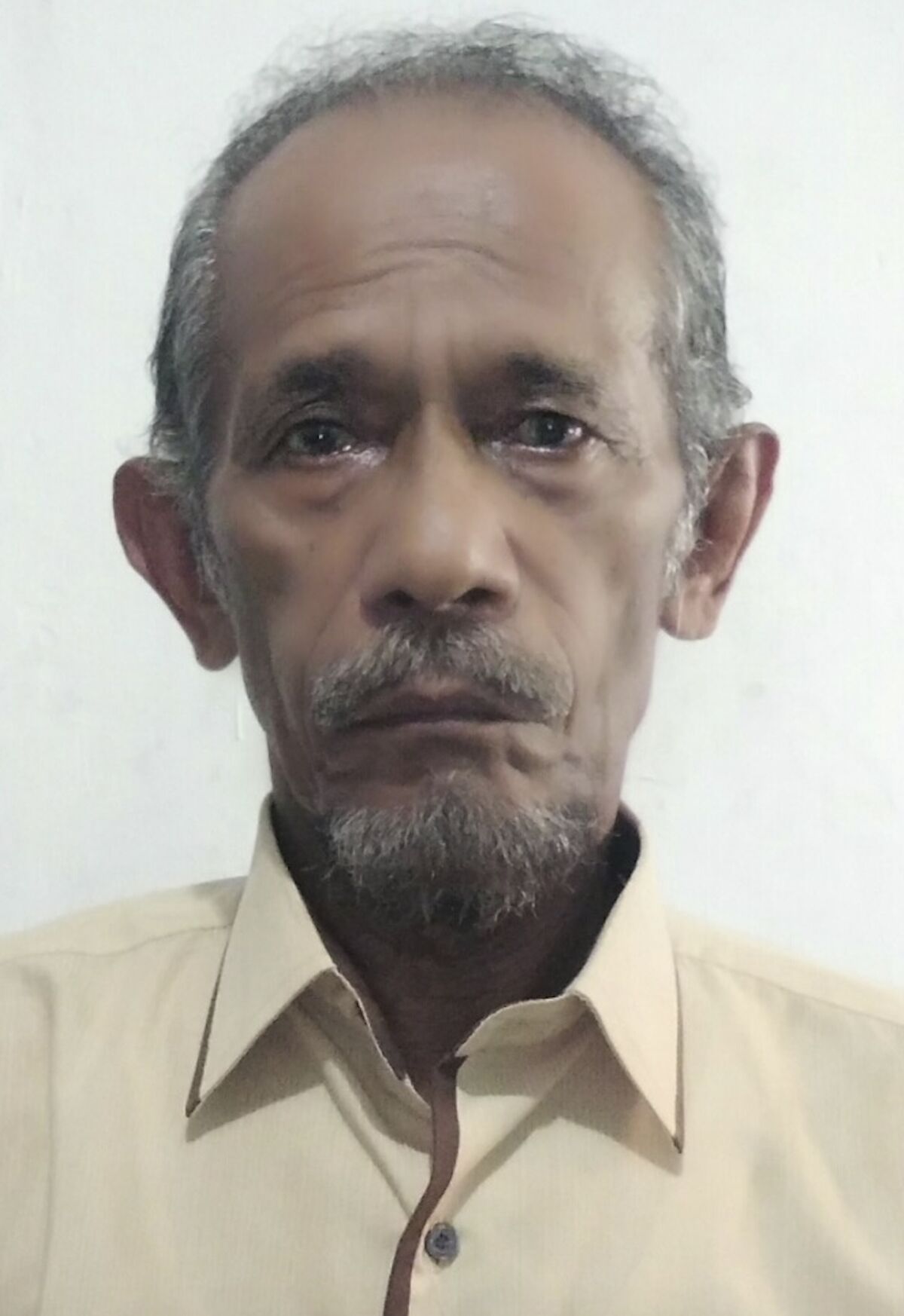 Associated Press journalist Ali Kotarumalos sits for a portrait in Jakarta, Indonesia, in 2018. Kotarumalos, who worked as a newsperson at the Jakarta bureau of the Associated Press for more than three decades, passed away on Wednesday, September 9, 2020 after battling can cer. He was 68. (AP Photo/Achmad Ibrahim)