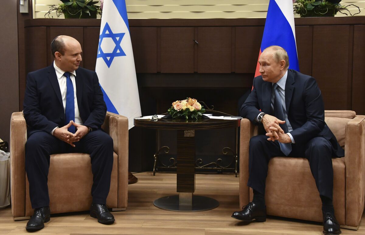 FILE - Russian President Vladimir Putin, right, and Israeli Prime Minister Naftali Bennett speak during their meeting in Sochi, Russia, Oct. 22, 2021. Just a year ago, Naftali Bennett was struggling for his political survival as Israel headed toward its fourth consecutive election. Today, the Israeli prime minister is at the forefront of global efforts to end the war in Ukraine. (Evgeny Biyatov, Sputnik, Kremlin Pool Photo via AP, File)