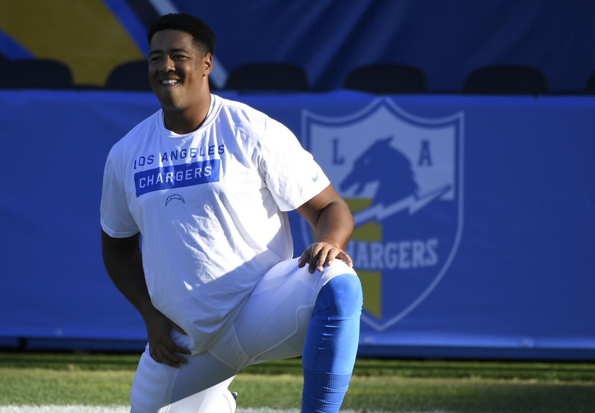 Chargers offensive lineman Trey Pipkins stretches before a game.