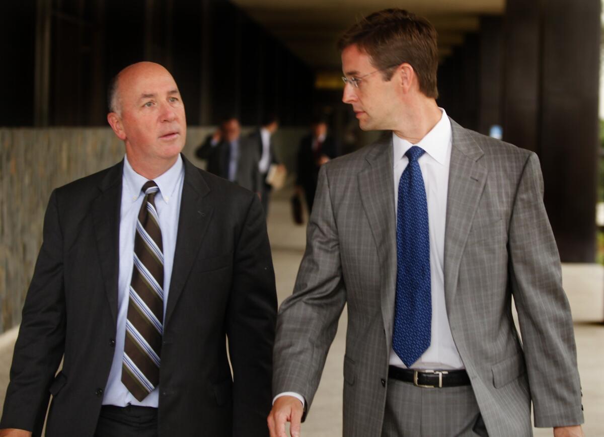 Kent Easter, right, leaves Orange County Superior Court in Santa Ana with his attorney, Thomas Bienert, in 2012.