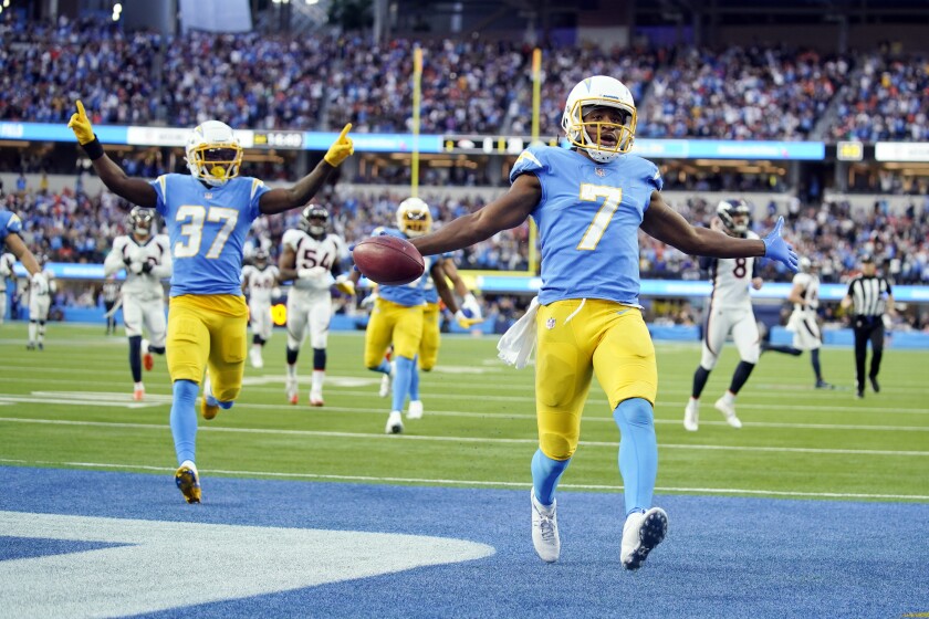 Los Angeles Chargers wide receiver Andre Roberts (7) returns a kick for a touchdown during the second half of an NFL football game against the Denver Broncos Sunday, Jan. 2, 2022, in Inglewood, Calif. (AP Photo/Jae C. Hong)