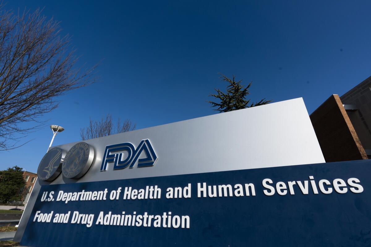 A silver and blue Food and Drug Administration sign.