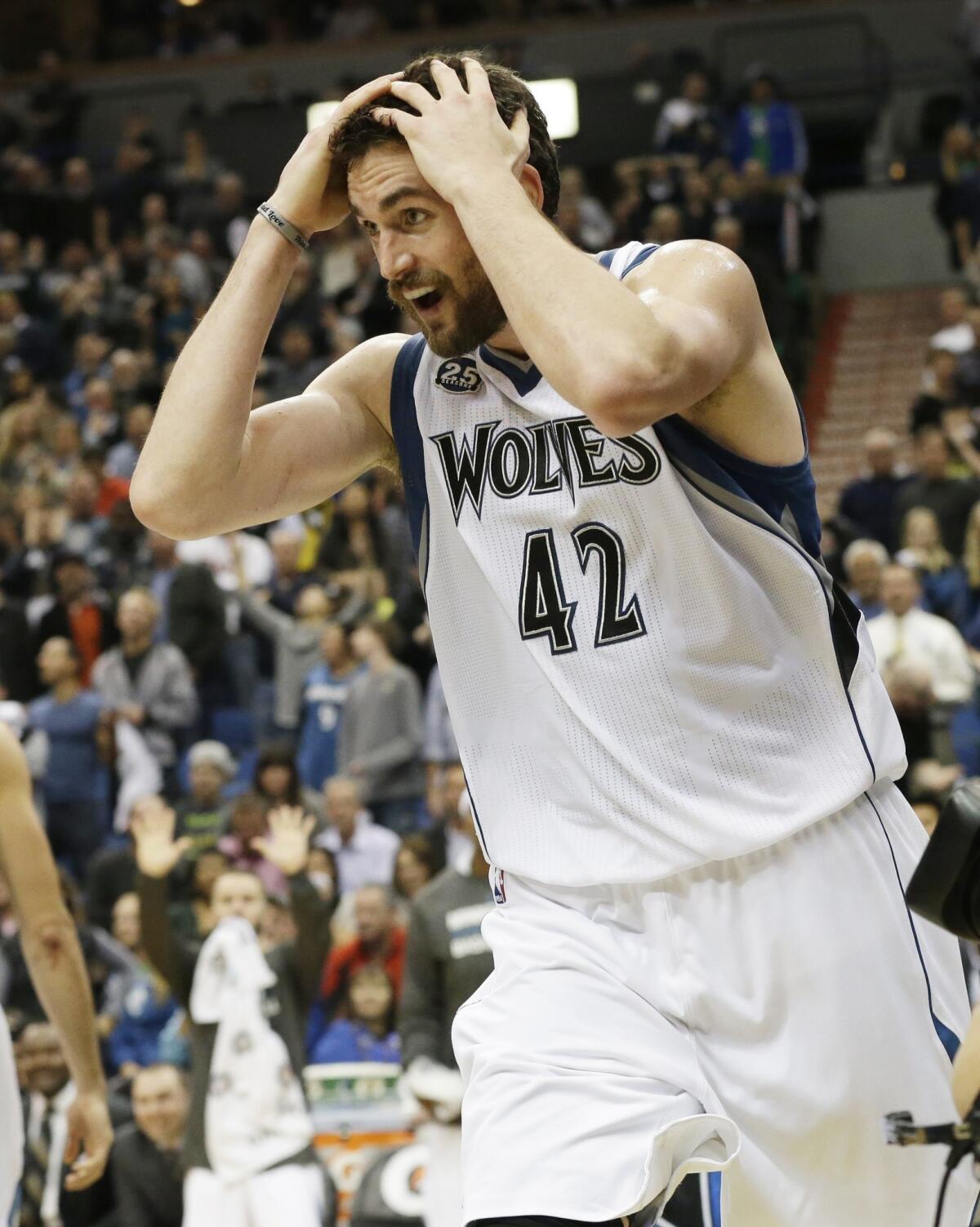 Minnesota's Kevin Love reacts in disbelief as he's called for a foul in overtime during the Timberwolves' 120-115 win over the Oklahoma City Thunder on Friday.