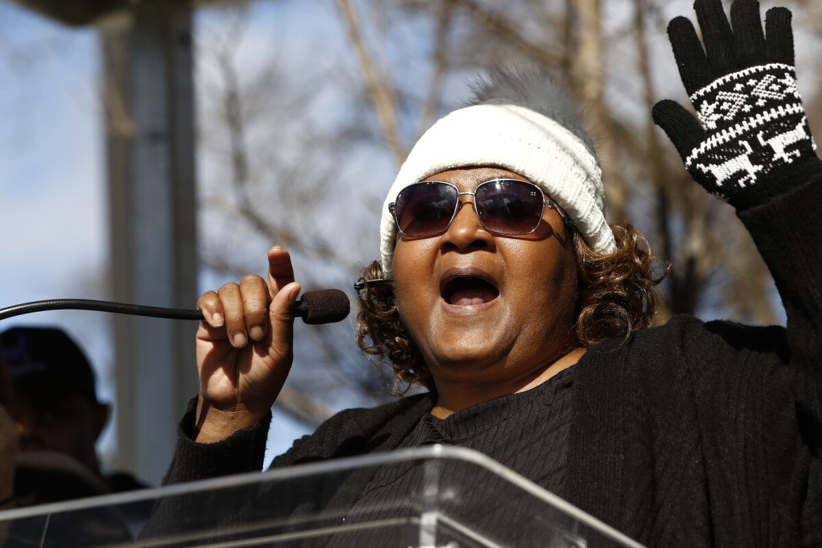 FILE - Jamie Scott leads a chant at a prison reform rally outside the Mississippi Capitol in Jackson, Miss., Friday, Jan. 24, 2020. Scott, who won freedom from prison a decade earlier after being convicted with her sister in a 1993 armed robbery in Mississippi, then went on to become an advocate for justice, died Nov. 9, 2021, of COVID-19. She was 49. (AP Photo/Rogelio V. Solis, File)