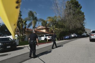 Police block the street to a house where three people were killed and four others wounded in a shooing at a short-term rental home in an upscale Los Angeles neighborhood on Saturday Jan. 28, 2023. The shooting occurred about 2:30 a.m. in the Beverly Crest neighborhood. (AP Photo/Richard Vogel)