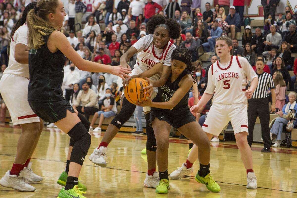 Sage Hill's Zoie Lamkin, right, competes for possession of the ball against Orange Lutheran on Feb. 26.