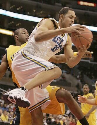 Ryan Hollins pulls down a rebound