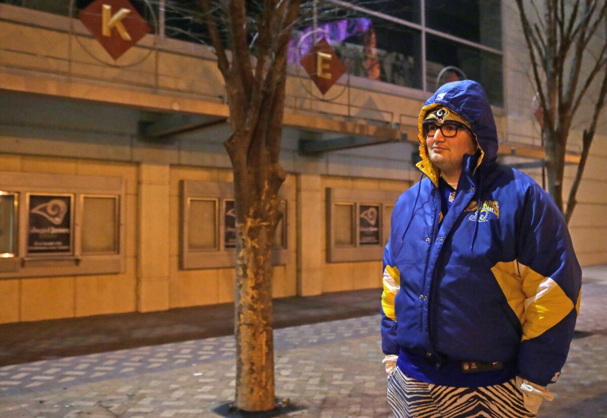 Rams fan Mickey Right stands outside the Edward Jones Dome on Jan. 12, the same day the NFL approved the team's relocation from St. Louis to Los Angeles.