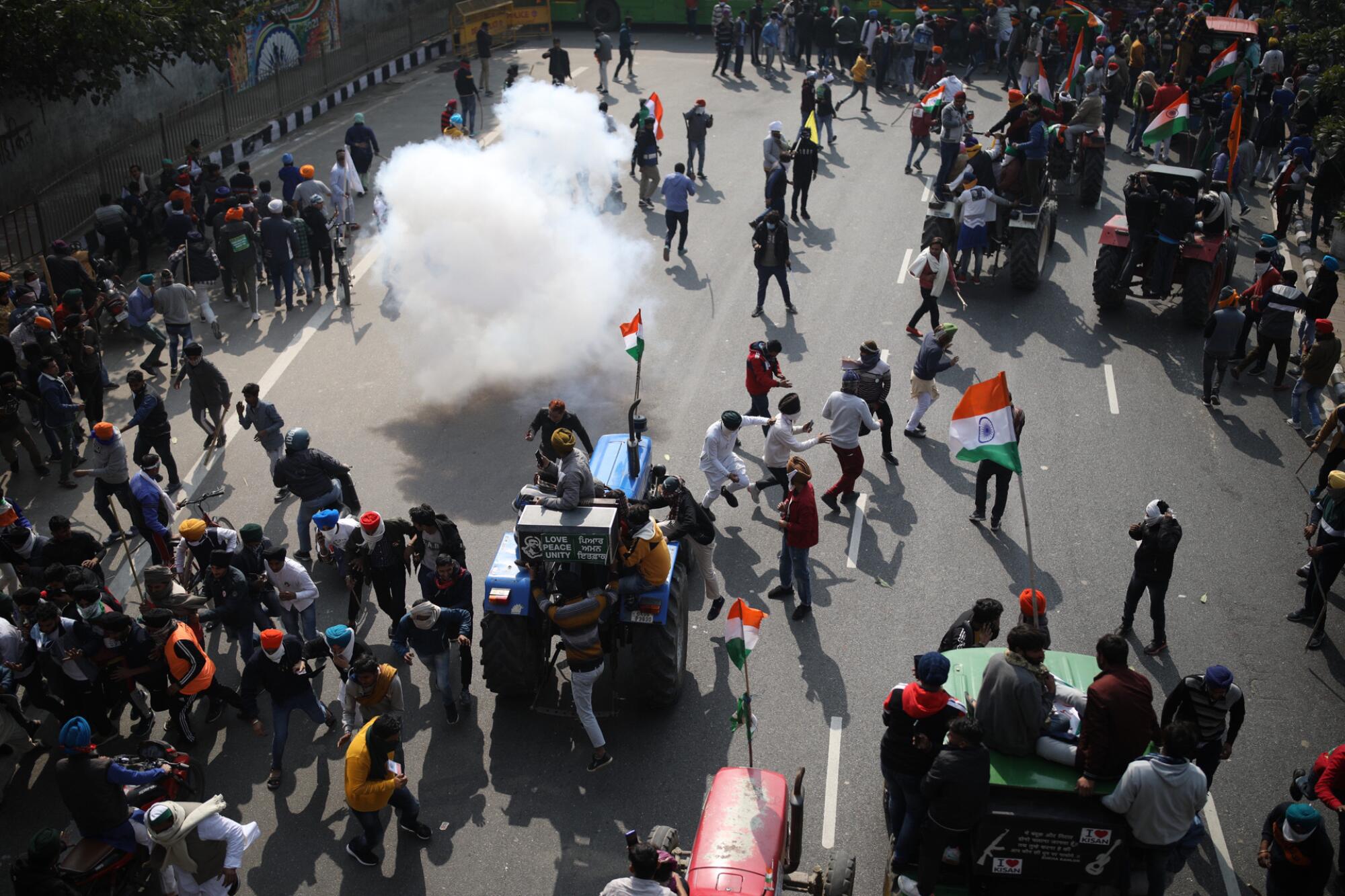 Police use tear gas to disperse farmers who marched to New Delhi during India's Republic Day celebrations on Tuesday.