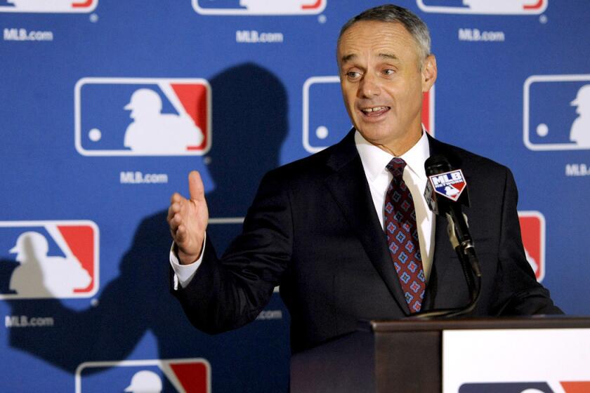 Rob Manfred, Major League Baseball's chief operating officer, speaks to reporters after team owners elected him as the next commissioner on Thursday during a meeting in Baltimore.