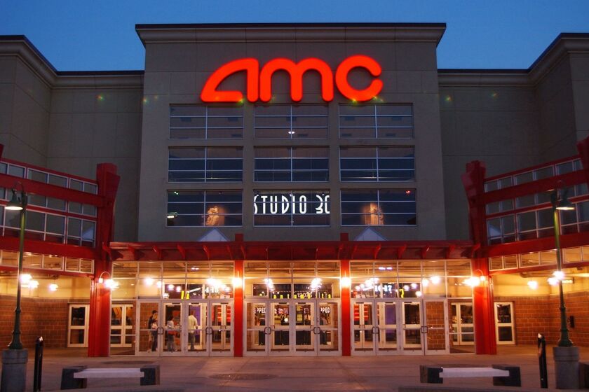FILE - In this May 11,2005 file photo, people enter AMC's Studio 30 theater in Olathe, Kan. AMC Theatres is buying European movie theater operator Odeon & UCI Cinemas Group in a deal valued at about 921 million pounds ($1.21 billion). AMC says, Tuesday, July 12, 2016, that the transaction will make it the biggest movie theater operator in the world. Odeon & UCI has 242 theaters in Europe. The deal will give AMC a total of 627 theaters in eight countries. (AP Photo/Orlin Wagner)
