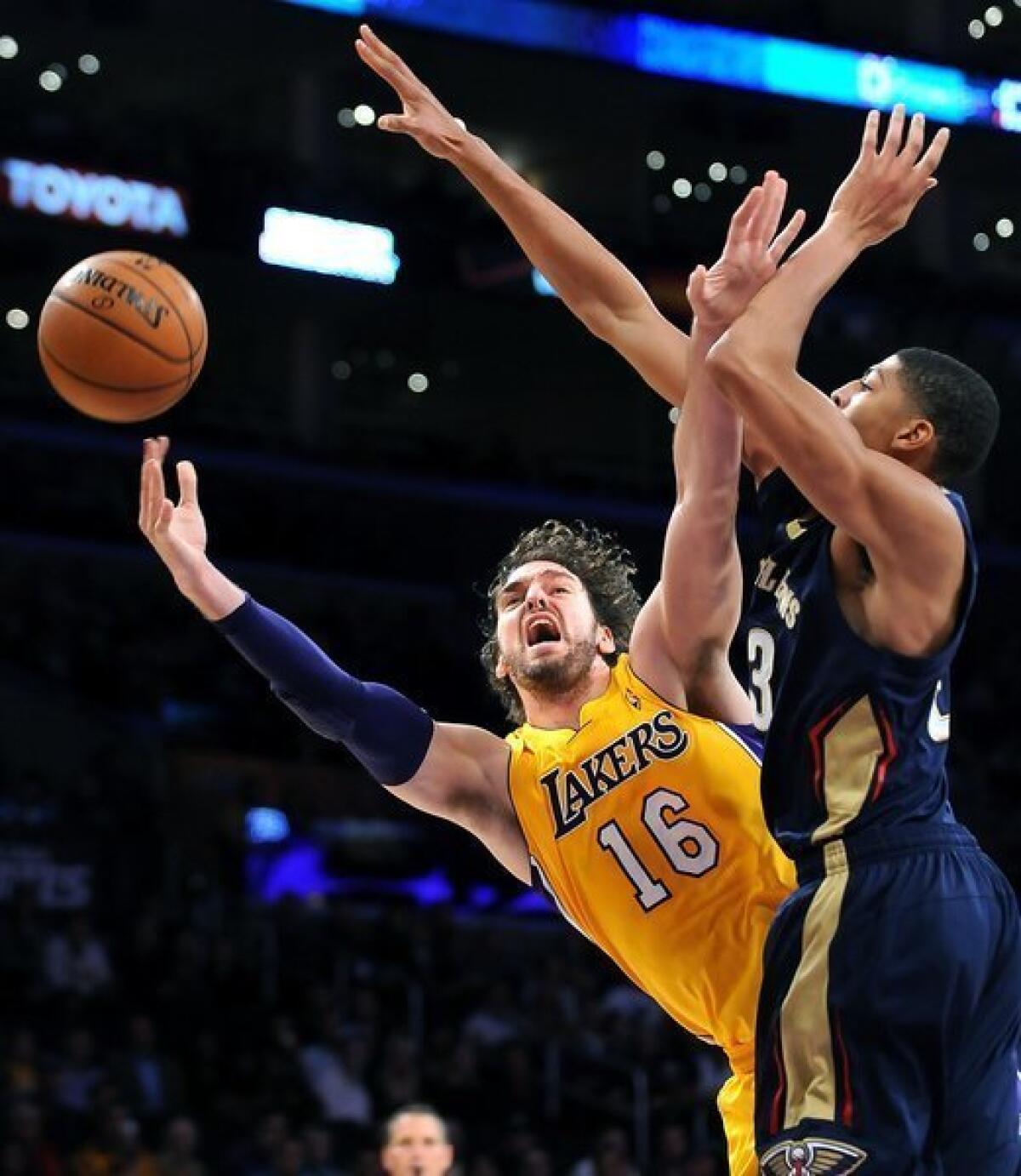 Pau Gasol shoots around New Orleans' Anthony Davis during the first half at Staples Center on Tuesday.