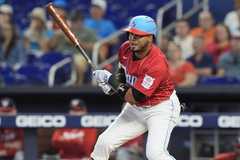 Miami Marlins' Luis Arraez hits a single during the first inning of a baseball game against the Washington Nationals, Saturday, April 27, 2024, in Miami. (AP Photo/Marta Lavandier)