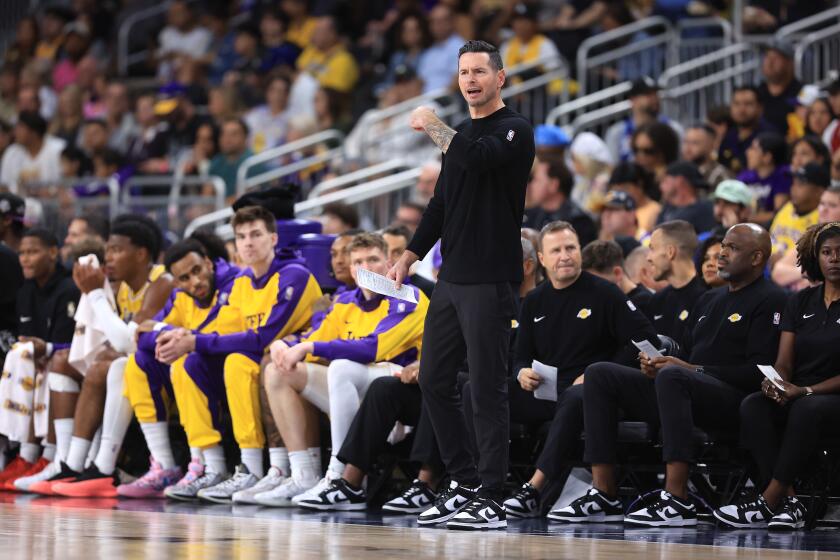 PALM SPRINGS, CALIFORNIA - OCTOBER 04: Los Angeles Lakers Head Coach JJ Redick looks on from the bench during the first half of a game against the Minnesota Timberwolves at Acrisure Arena on October 04, 2024 in Palm Springs, California. (Photo by Sean M. Haffey/Getty Images)