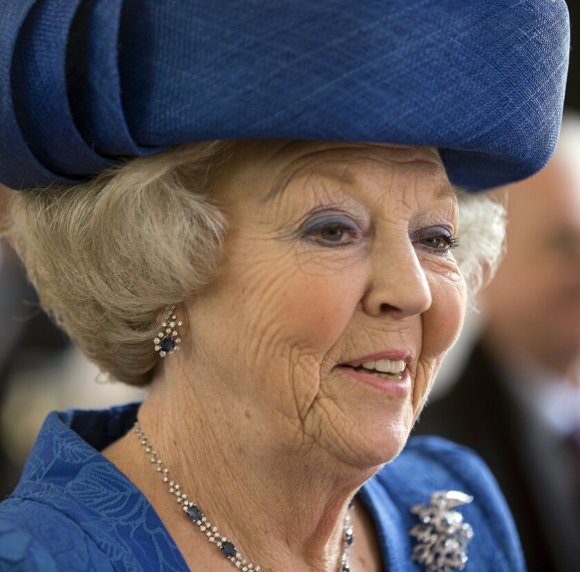 FILE - Dutch Queen Beatrix smiles when touring a museum in the Netherlands, in this Monday April 8, 2013 file photo. Princess Beatrix, the 83-year-old former Dutch queen, has tested positive for the coronavirus, the royal house announced Saturday. (AP Photo/Peter Dejong, File).