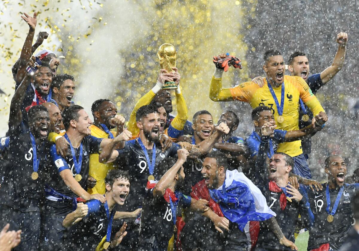 In this Sunday, July 15, 2018 file photo, France goalkeeper Hugo Lloris lifts the trophy after France won 4-2 during the final match between France and Croatia at the 2018 soccer World Cup in the Luzhniki Stadium in Moscow, Russia. World Cup winner France reclaims the No. 1 spot in the FIFA rankings for the first time in 16 years after defeating Croatia 4-2 for its second World Cup title and jumped up six places. (AP Photo/Martin Meissner, File)