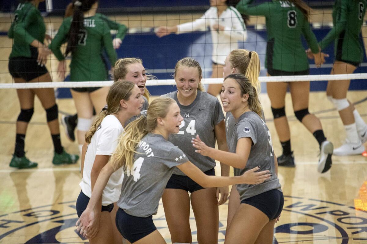 Newport Harbor celebrates after winning a point against Sage Hill in a nonleague match at home on Tuesday.