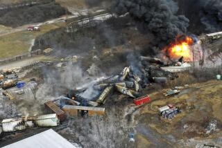 FILE - Debris from a Norfolk Southern freight train lies scattered and burning along the tracks on Feb. 4, 2023, the day after it derailed in East Palestine, Ohio. East Palestine residents will learn more Tuesday about the fiery Norfolk Southern train crash that derailed their lives last year when the National Transportation Safety Board holds another hearing in their eastern Ohio hometown to discuss what their investigation uncovered and their recommendations to prevent future disasters. (AP Photo/Gene J. Puskar, File)